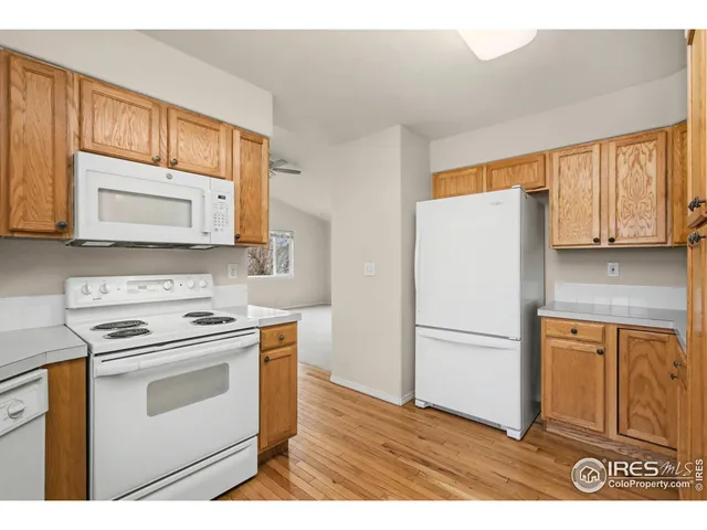 a kitchen with a stove microwave and refrigerator