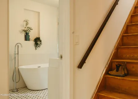 a bathroom with a sink and mirror
