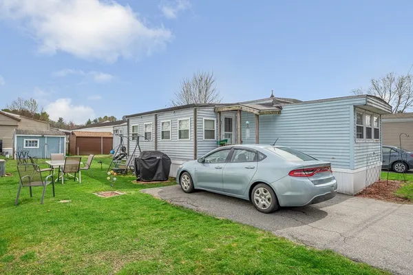 a car parked in front of a house