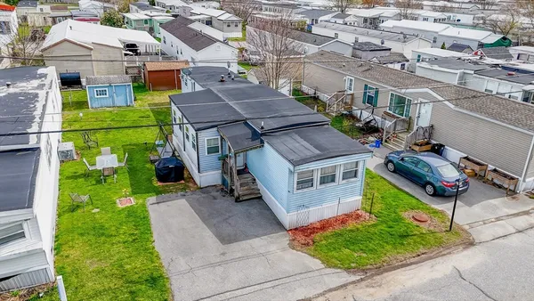 a aerial view of a house with a yard