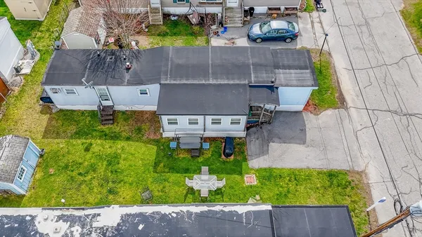 an aerial view of a house with a garden