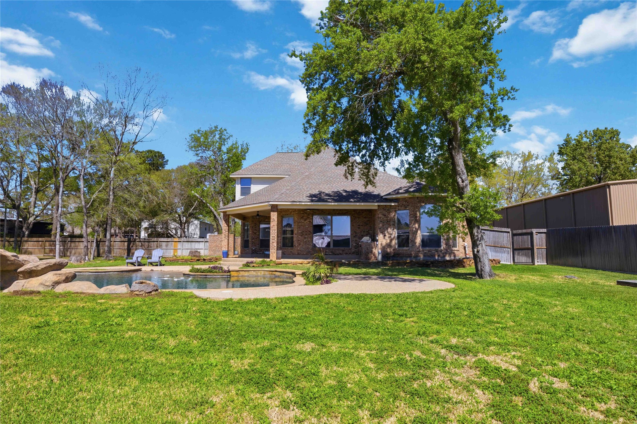 1930 Old River Road Montgomery, TX 77356 - Photo 40 of 49 There is so much to love about this backyard! Of course, there's an amazing pool, a welcoming covered patio, and a kitchen. But with the extra space, what will you design?