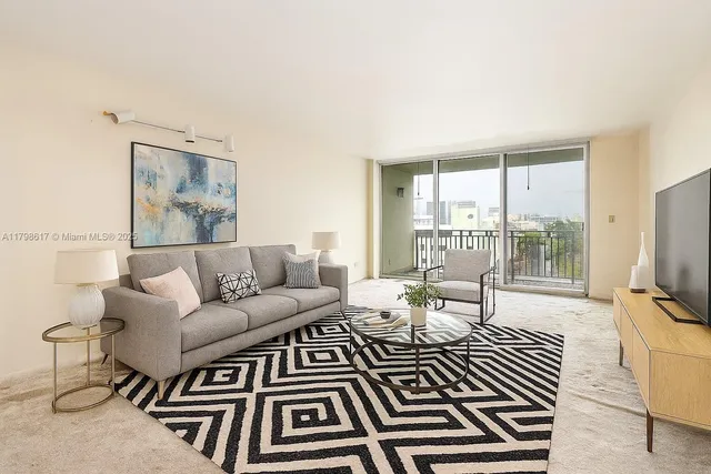 a kitchen with a stove a sink and a refrigerator