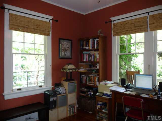 414 Cutler Street Raleigh, NC 27603 - Photo 7 of 12 Overlooking the large front porch is the front study/office/guest room that shares a half bath with the middle bedroom below. Studio/Study/Office