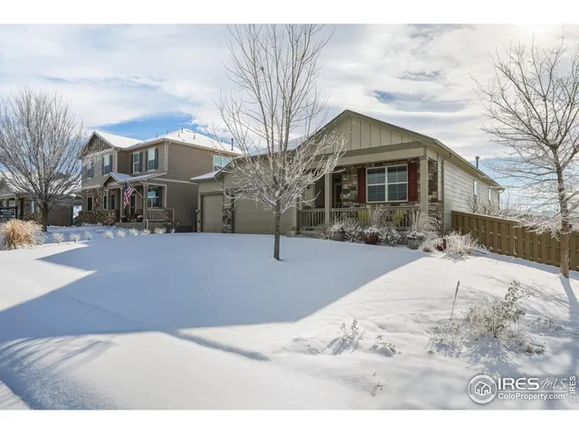 a view of a house with snow on the background