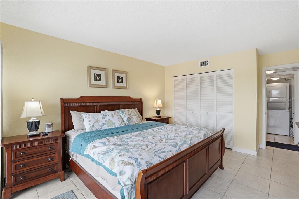 3170 Matecumbe Key Road, Unit 127 Punta Gorda, FL 33955 - Photo 12 of 22 a bedroom with a bed and a night stand