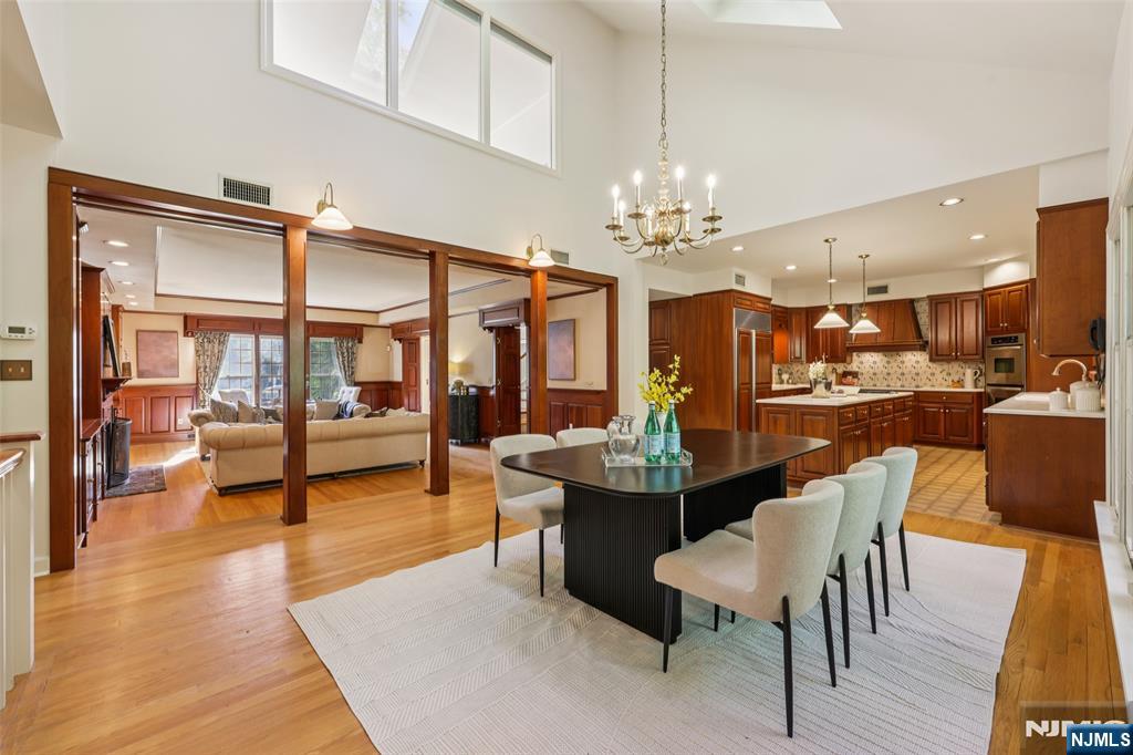 119 Sheridan Terrace Ridgewood, NJ 07450 - Photo 11 of 44 a view of a dining room with furniture and wooden floor