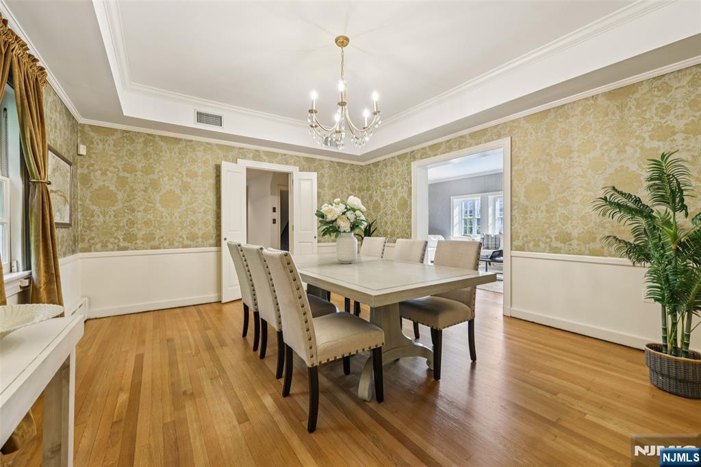 119 Sheridan Terrace Ridgewood, NJ 07450 - Photo 17 of 44 a view of a dining room with furniture window and wooden floor