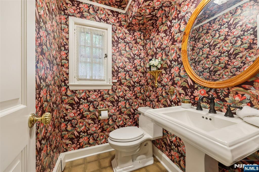 119 Sheridan Terrace Ridgewood, NJ 07450 - Photo 19 of 44 a bathroom with a sink toilet and mirror