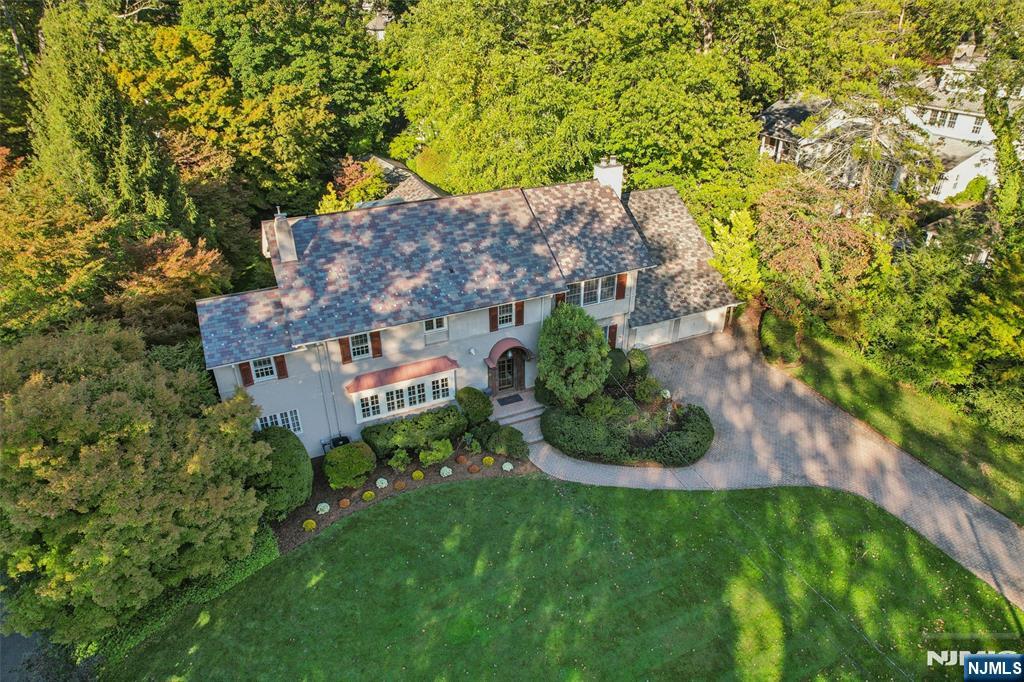 119 Sheridan Terrace Ridgewood, NJ 07450 - Photo 2 of 44 an aerial view of a house with a yard