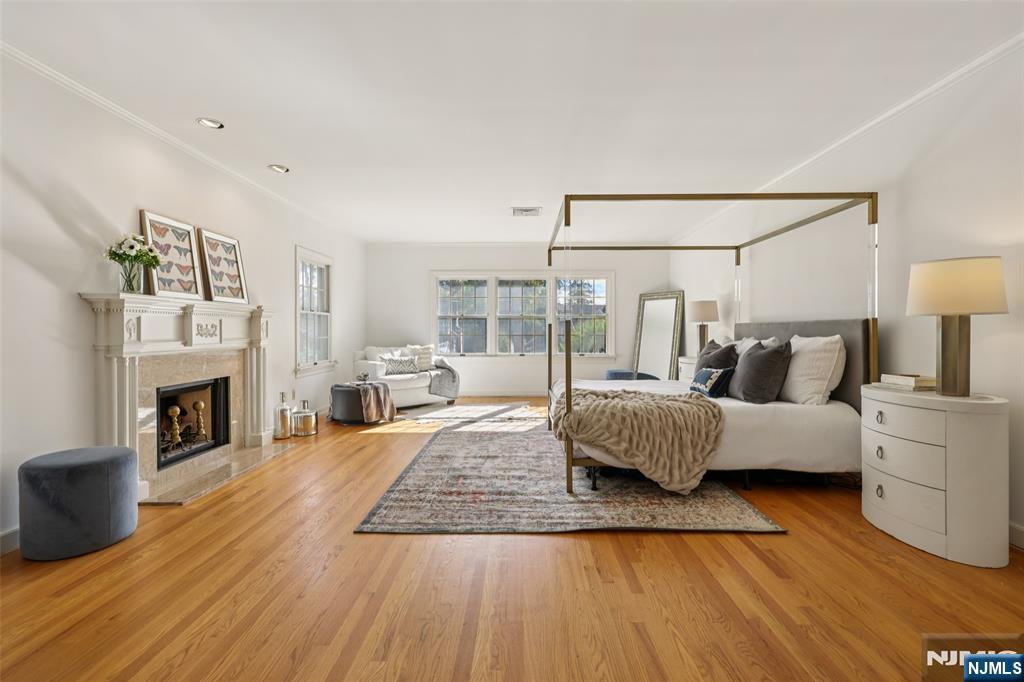 119 Sheridan Terrace Ridgewood, NJ 07450 - Photo 24 of 44 a living room with furniture and a fireplace