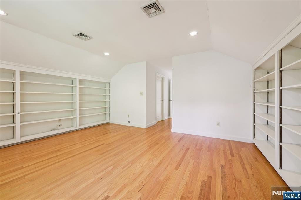 119 Sheridan Terrace Ridgewood, NJ 07450 - Photo 25 of 44 a view of an empty room with wooden floor and closet