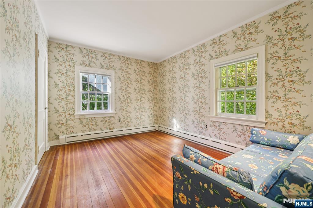 119 Sheridan Terrace Ridgewood, NJ 07450 - Photo 34 of 44 a view of an empty room with wooden floor and a window