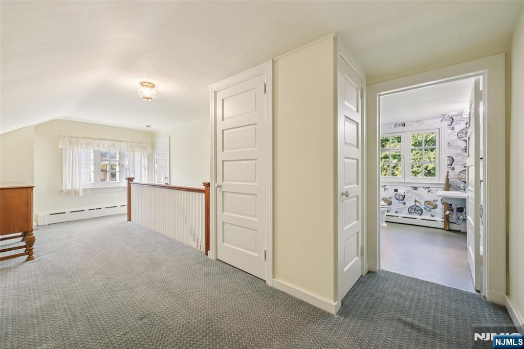 119 Sheridan Terrace Ridgewood, NJ 07450 - Photo 35 of 44 a view of a bedroom with closet and cabinet