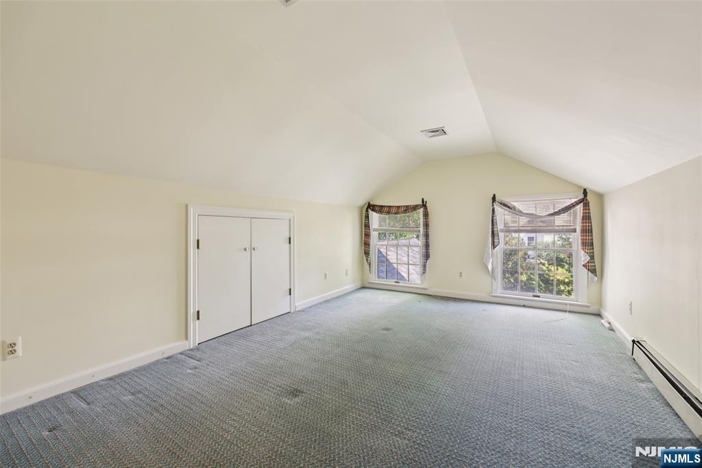 119 Sheridan Terrace Ridgewood, NJ 07450 - Photo 37 of 44 an empty room with windows and closet