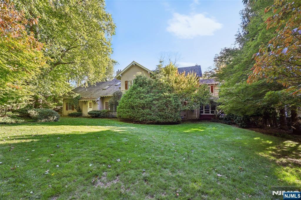 119 Sheridan Terrace Ridgewood, NJ 07450 - Photo 39 of 44 a view of a big yard with plants and large trees