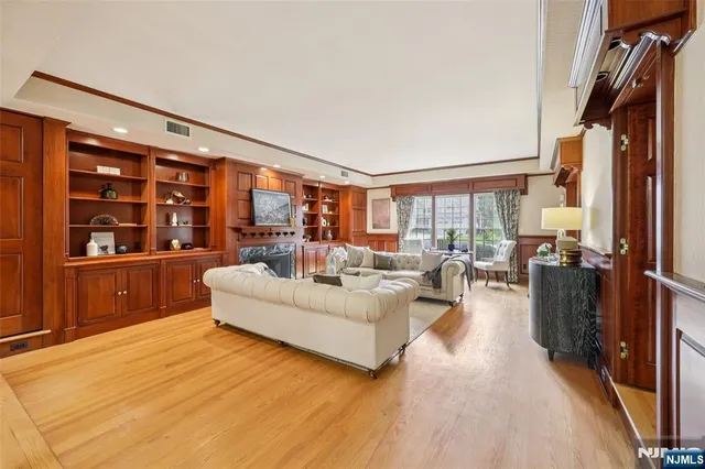 a living room with furniture and large window