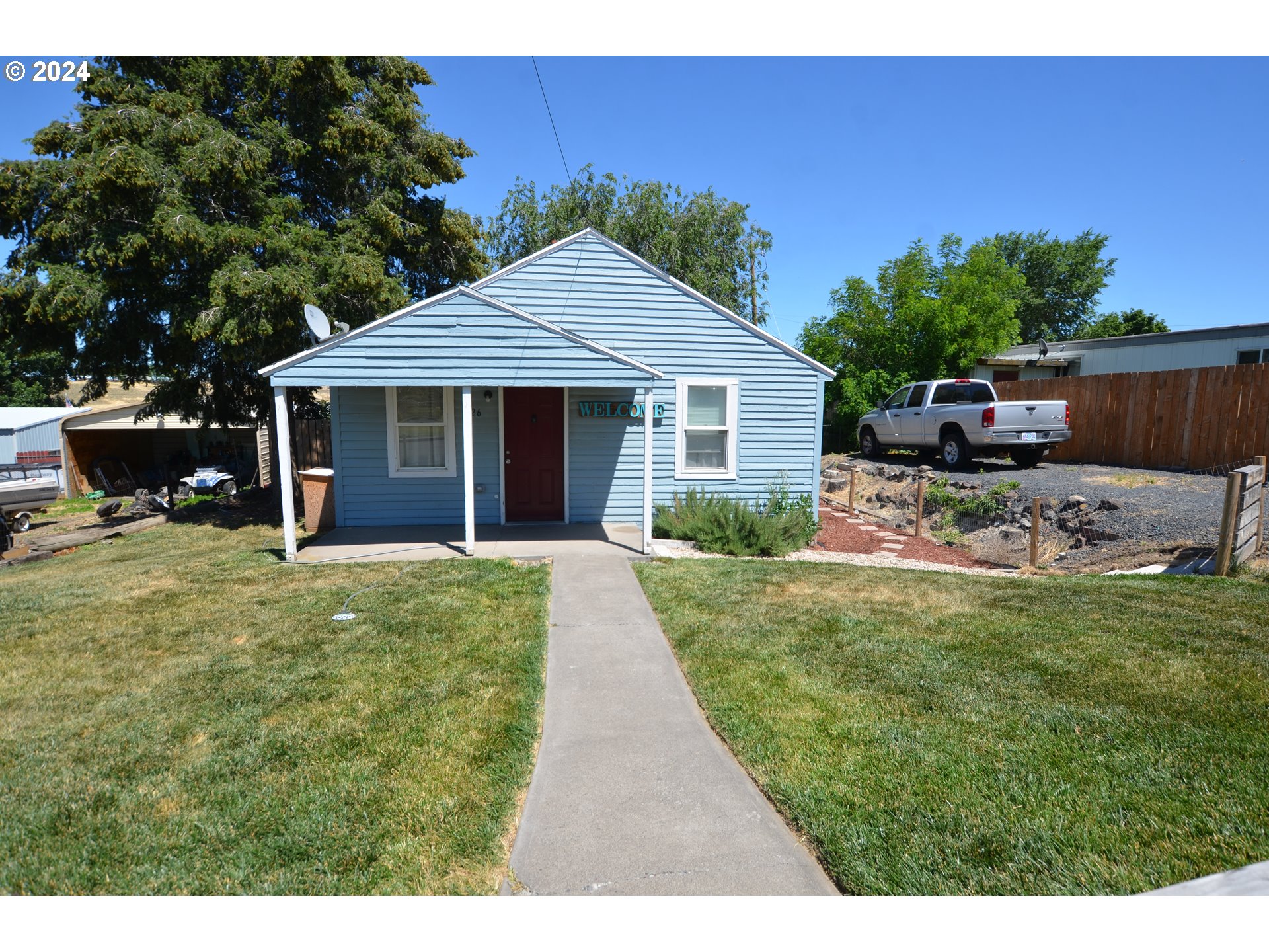 826 Southeast 8th Street Pendleton, OR 97801 - Photo 2 of 13 a front view of a house with a yard