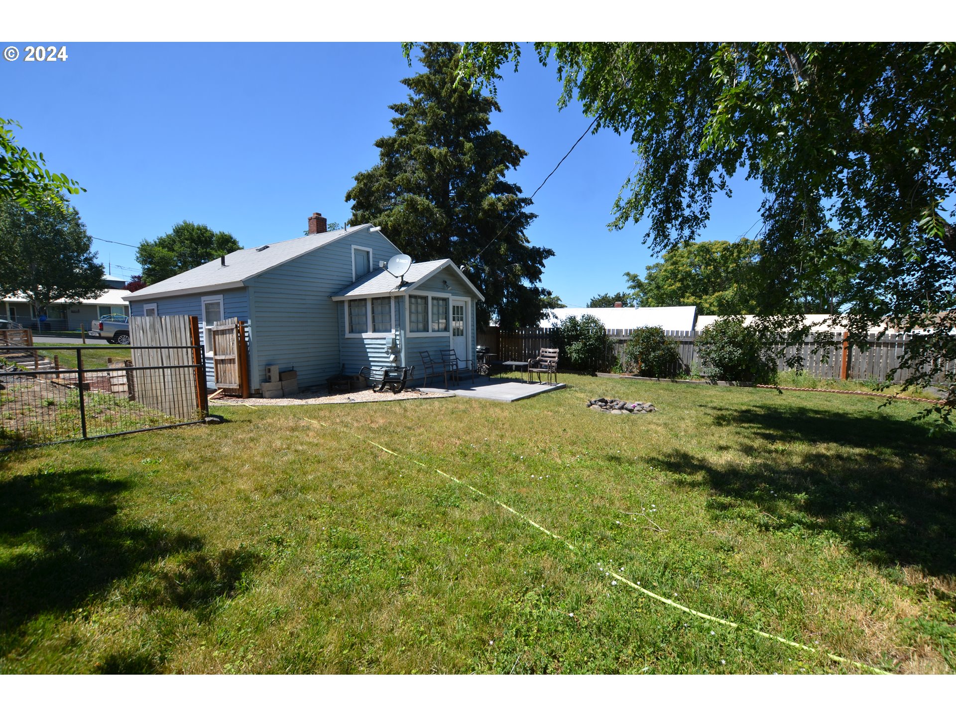 826 Southeast 8th Street Pendleton, OR 97801 - Photo 3 of 13 a view of a house with a big yard