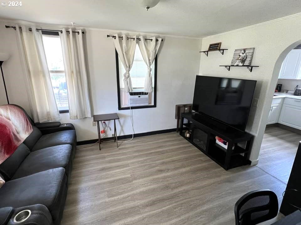 826 Southeast 8th Street Pendleton, OR 97801 - Photo 8 of 13 a living room with furniture and a flat screen tv
