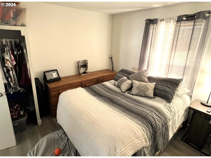 826 Southeast 8th Street Pendleton, OR 97801 - Photo 9 of 13 a bedroom with a bed and a flat tv screen
