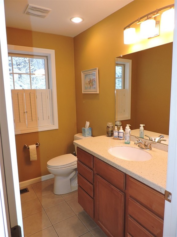 8 Reid Smith Cove Road Webster, MA 01570 - Photo 13 of 30 a bathroom with a toilet sink and mirror