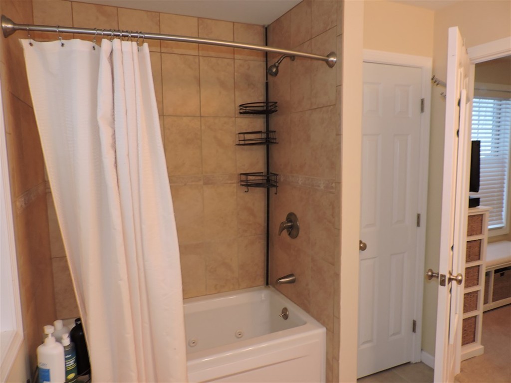 8 Reid Smith Cove Road Webster, MA 01570 - Photo 17 of 30 a bathroom with a shower and a tub