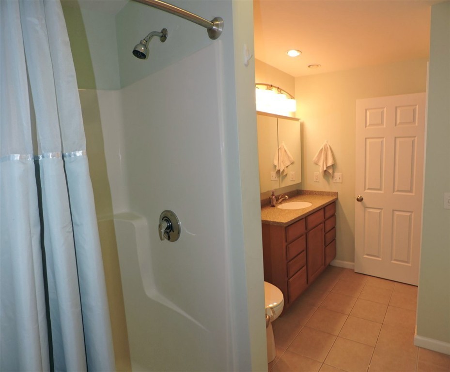 8 Reid Smith Cove Road Webster, MA 01570 - Photo 21 of 30 a bathroom with a sink a toilet and shower