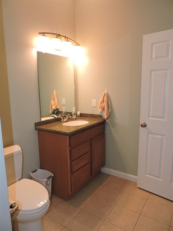 8 Reid Smith Cove Road Webster, MA 01570 - Photo 27 of 30 a bathroom with a toilet a sink and mirror