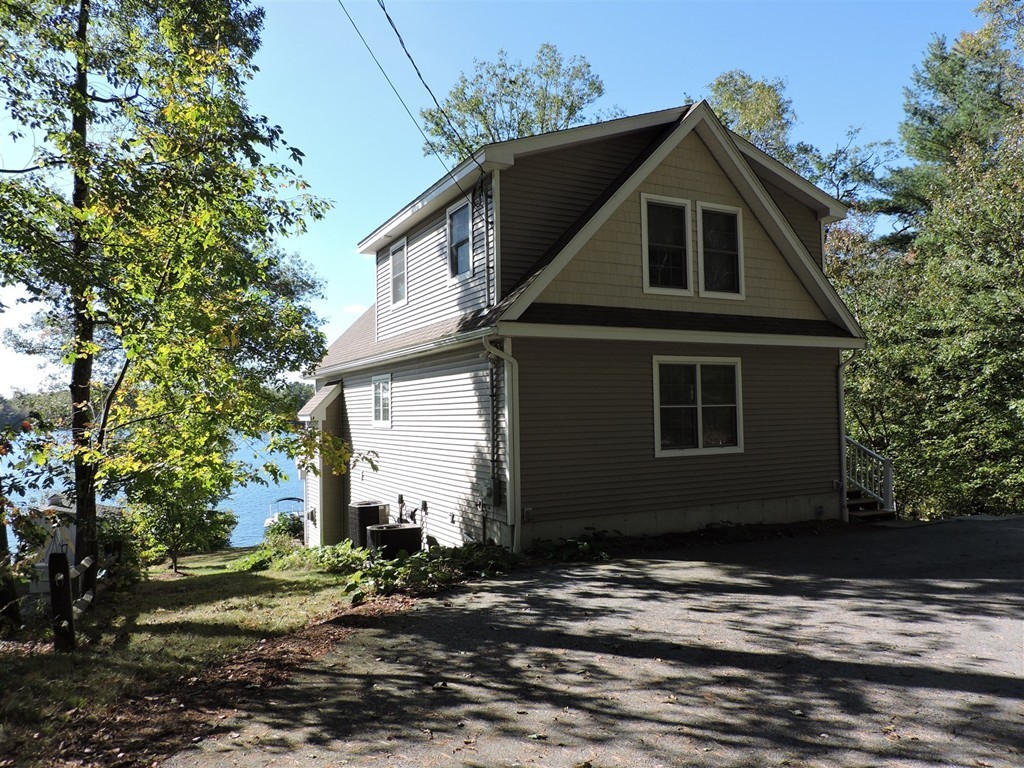 8 Reid Smith Cove Road Webster, MA 01570 - Photo 30 of 30 a front view of a house with a yard