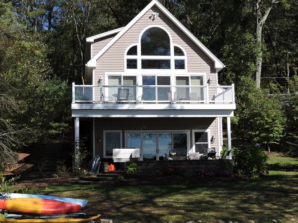 8 Reid Smith Cove Road Webster, MA 01570 - Photo 4 of 30 a front view of a house with garden
