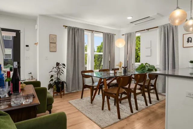 a view of a dining room with furniture window and outside view