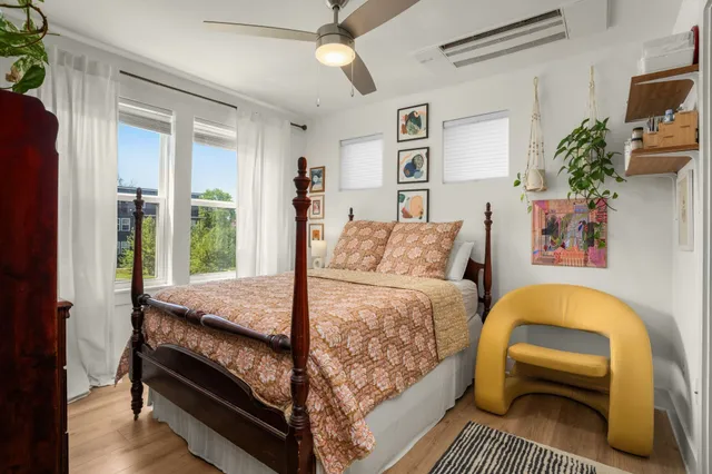 a bedroom with a bed and a couch