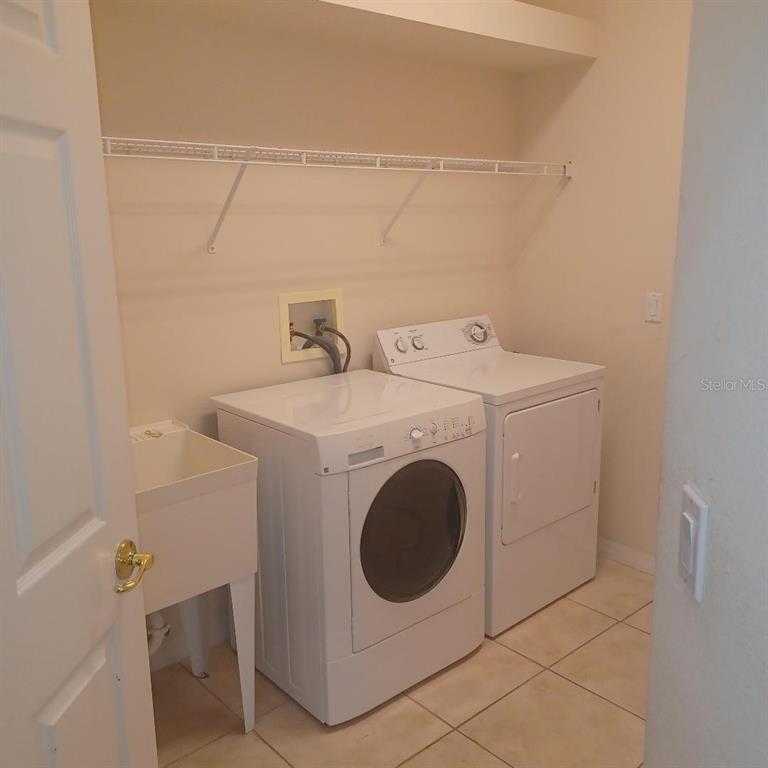3807 Beacon Ridge Way Clermont, FL 34711 - Photo 15 of 15 a utility room with dryer and washer