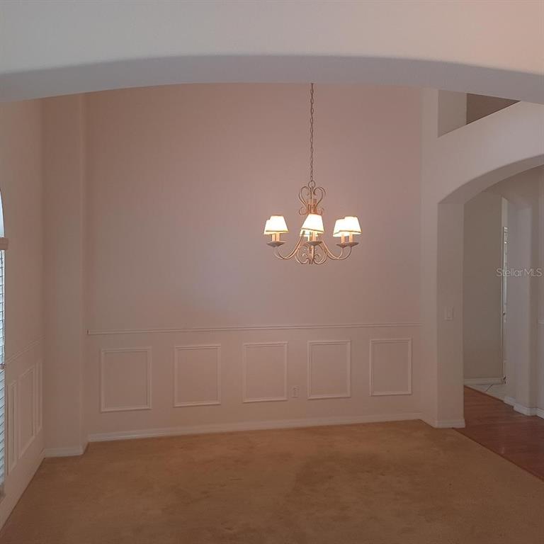 3807 Beacon Ridge Way Clermont, FL 34711 - Photo 4 of 15 a view of a chandelier fan and entryway
