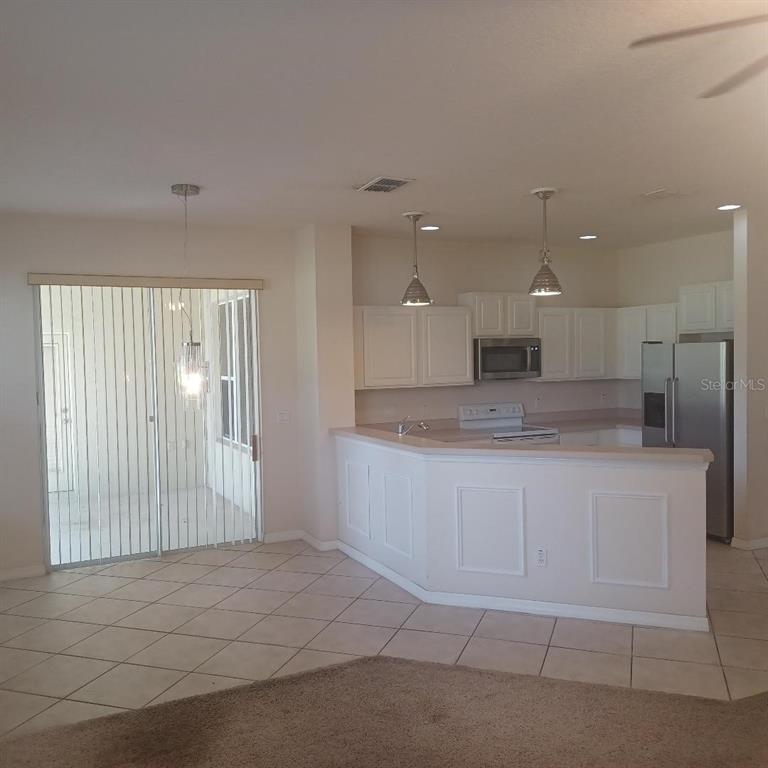 3807 Beacon Ridge Way Clermont, FL 34711 - Photo 8 of 15 a large bathroom with a large mirror vanity and shower