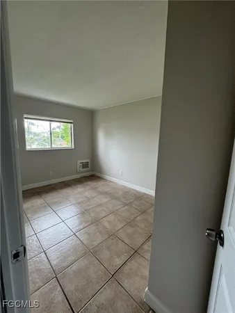 a view of an empty room with a window