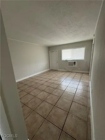 a view of a kitchen with white cabinets