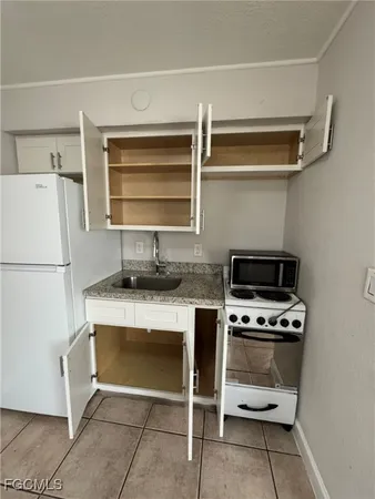 a kitchen with a cabinets and appliances