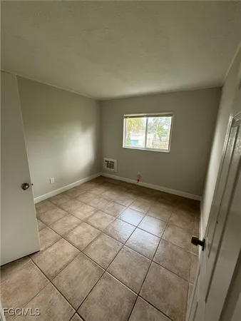 a view of room with window and hardwood floor