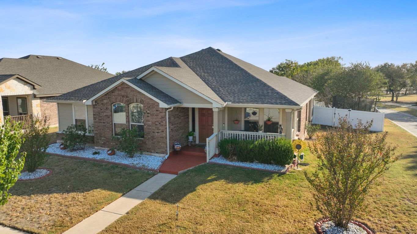 Undisclosed Address Pflugerville, TX 78660 - Photo 1 of 1 a front view of a house with a yard
