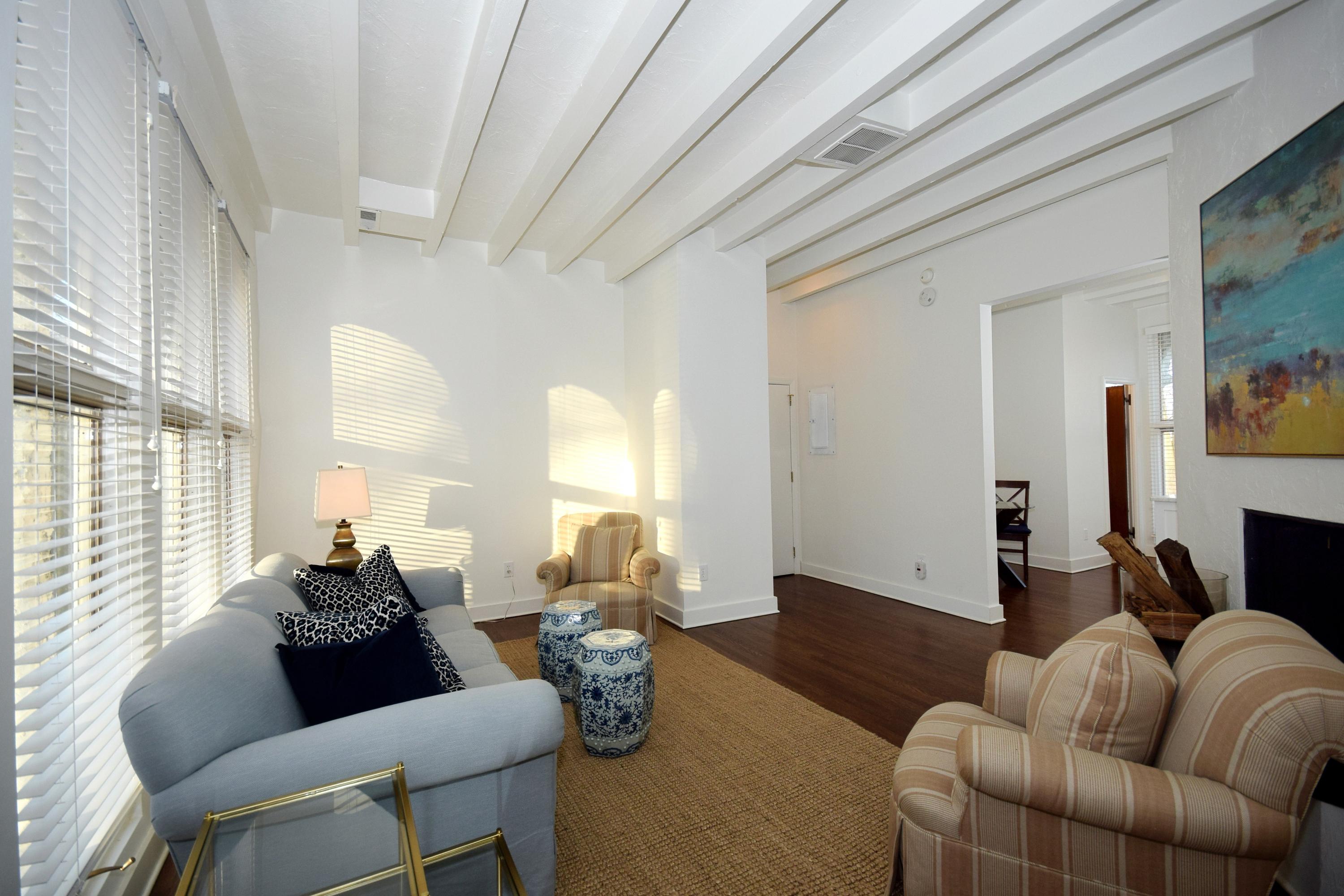 446 Hollow Tree Ridge Road, Unit 3 Darien, CT 06820 - Photo 8 of 19 a living room with furniture and a large window