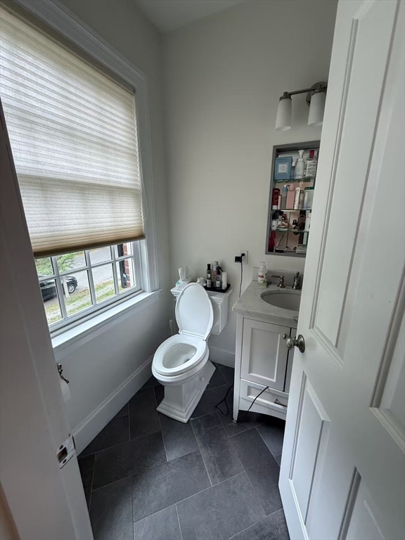 15 Cedar Road Brookline, MA 02467 - Photo 24 of 26 a bathroom with a toilet sink and mirror