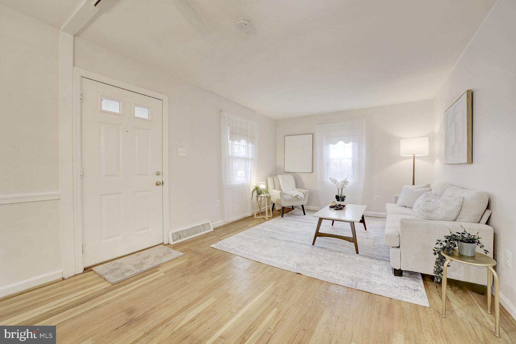 12216 Charles Road Silver Spring, MD 20906 - Photo 3 of 22 a living room with furniture and wooden floor