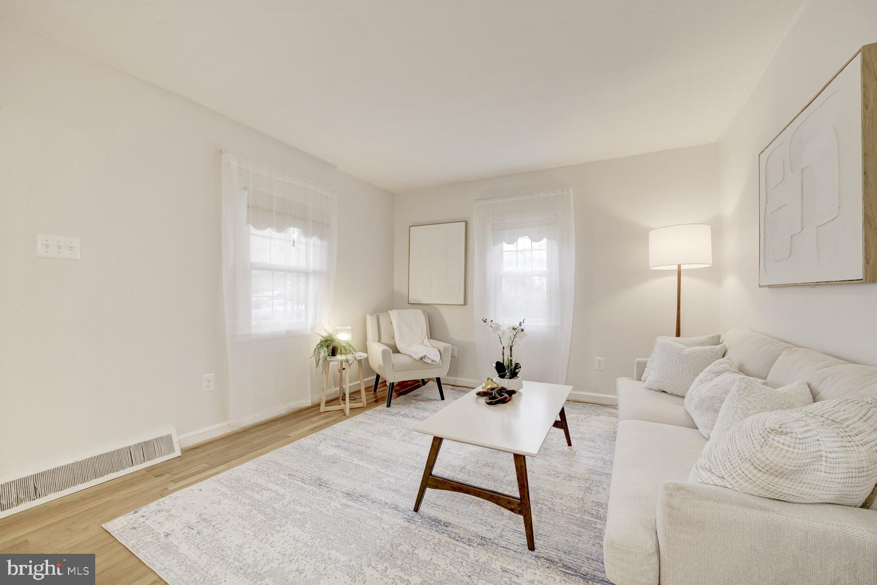 12216 Charles Road Silver Spring, MD 20906 - Photo 6 of 22 a living room with furniture a lamp and a table