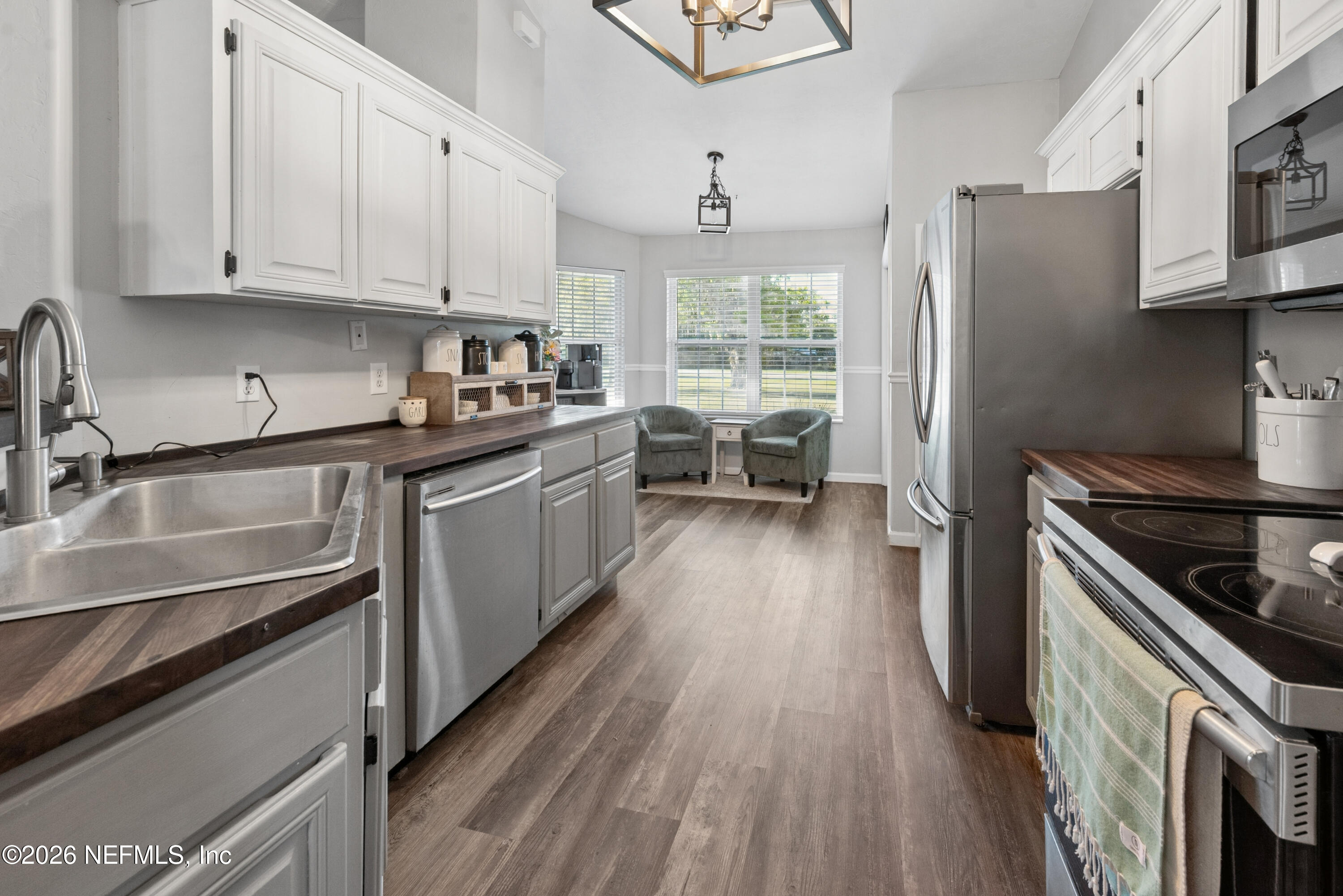1659 Highway 230 Starke, FL 32091 - Photo 11 of 48 a kitchen with stainless steel appliances a sink dishwasher stove and refrigerator