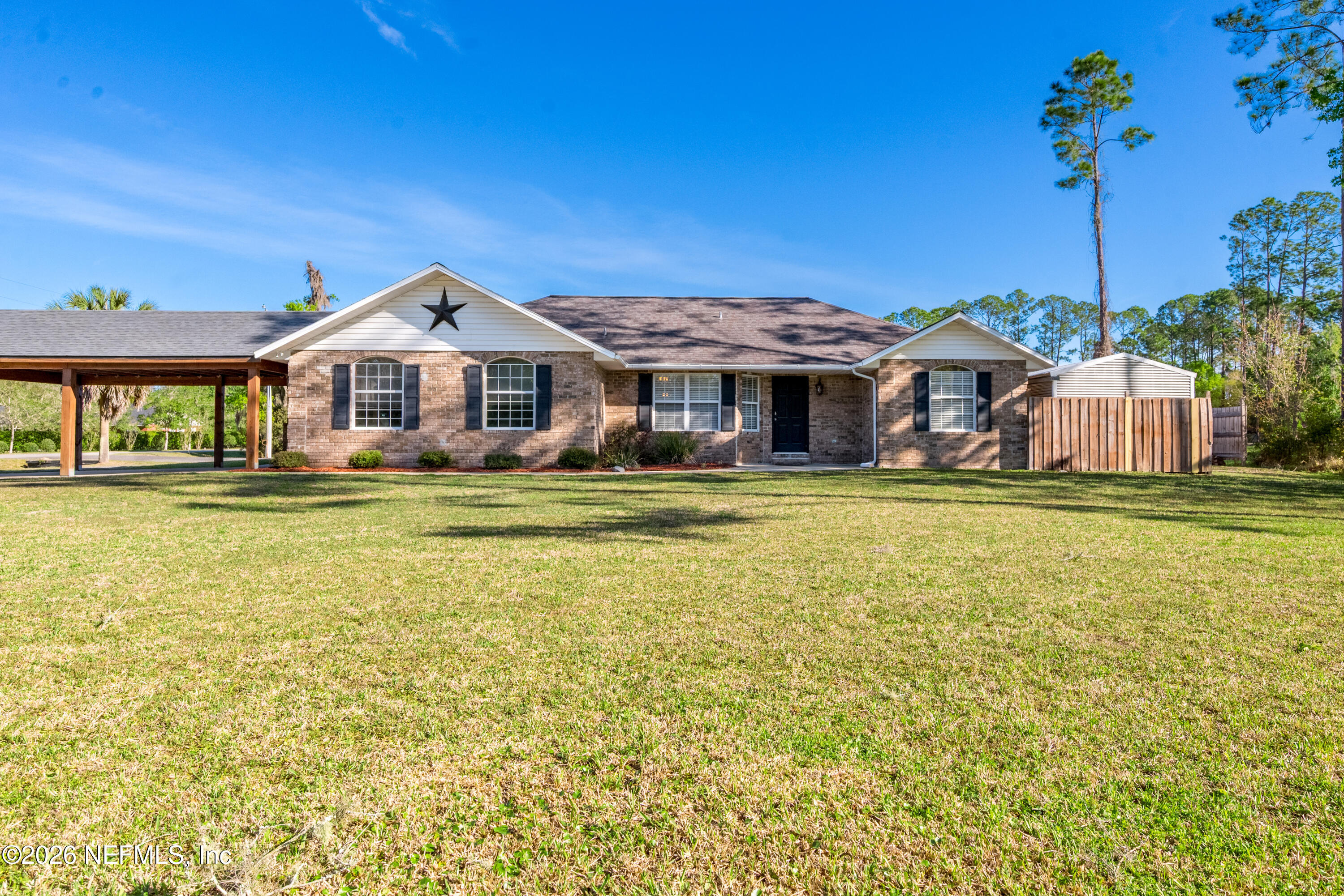 1659 Highway 230 Starke, FL 32091 - Photo 2 of 48 a front view of a house with a yard