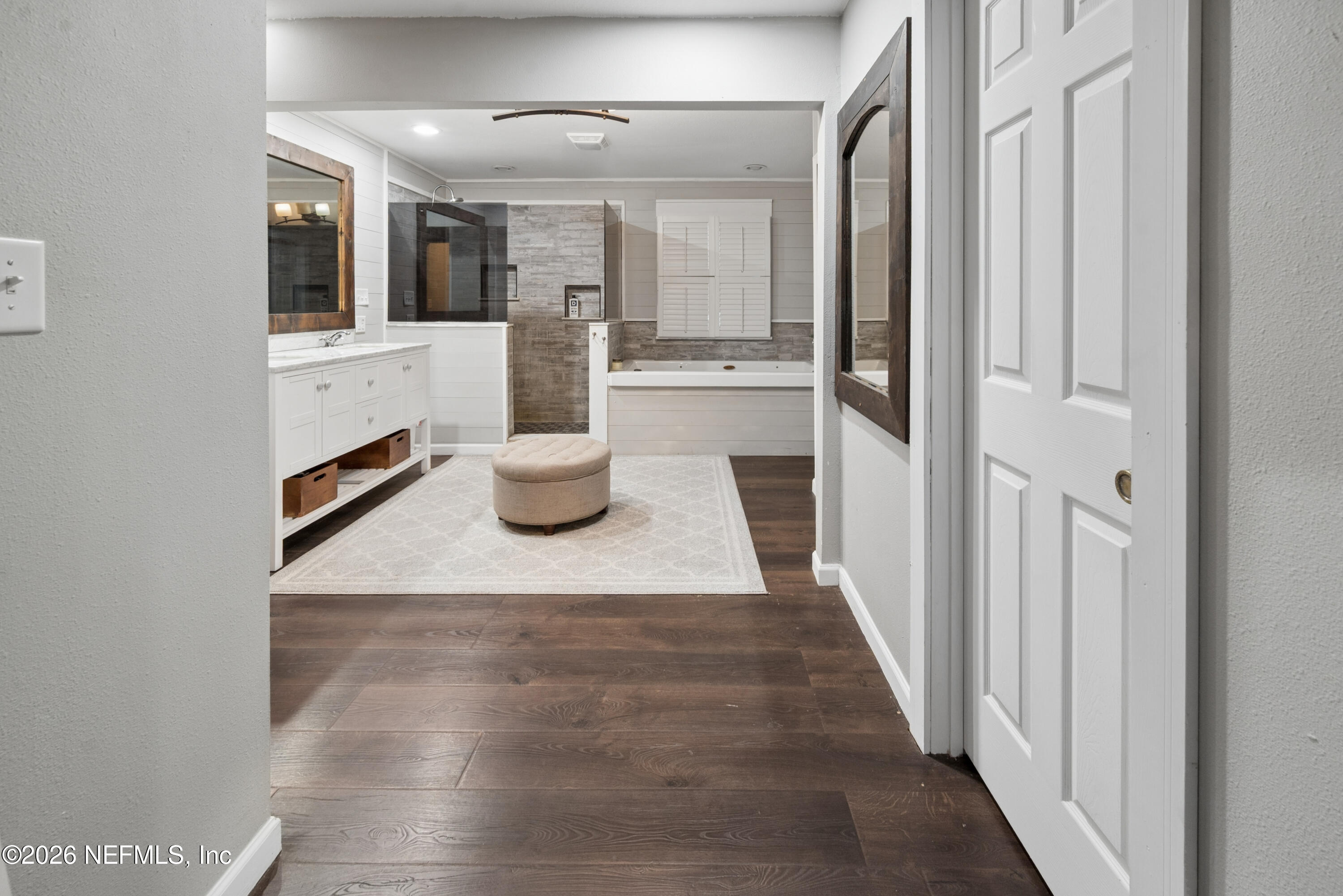 1659 Highway 230 Starke, FL 32091 - Photo 21 of 48 a hallway with white cabinets and wooden floor