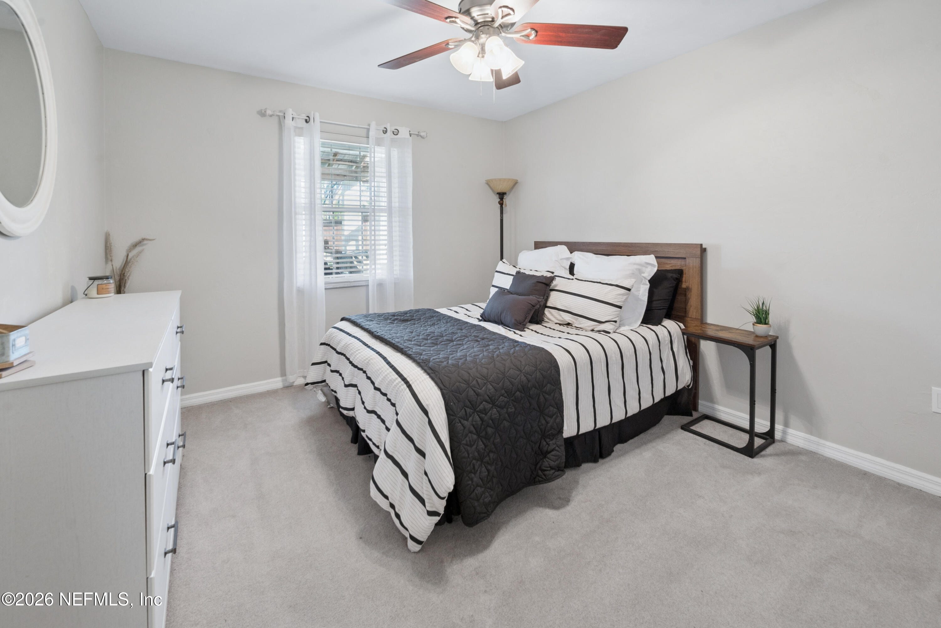 1659 Highway 230 Starke, FL 32091 - Photo 26 of 48 a bedroom with a bed and a ceiling fan