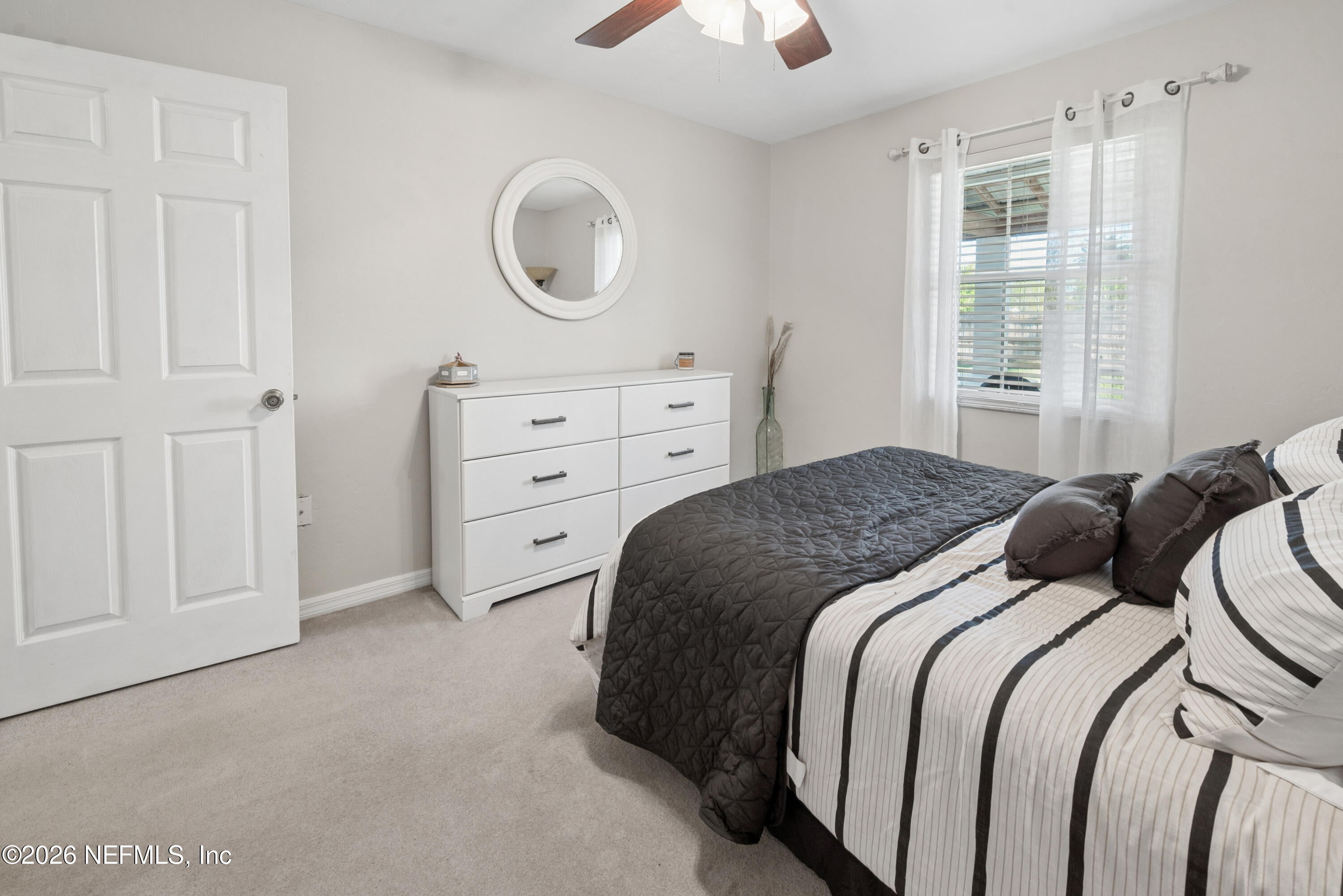 1659 Highway 230 Starke, FL 32091 - Photo 27 of 48 a bedroom with a bed and a chandelier